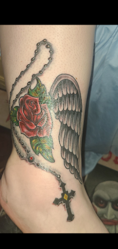 Work by At Gunpoint Tattoos