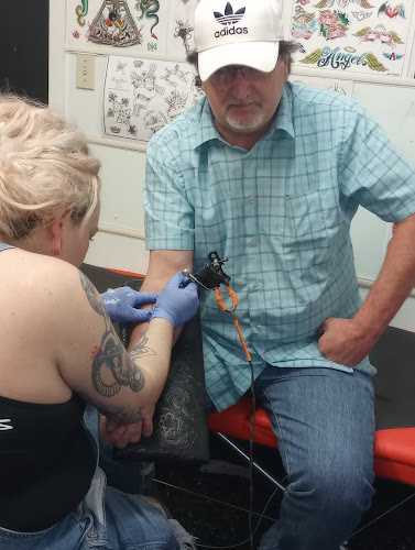 Work by Illustrated Man Tattoo Studio