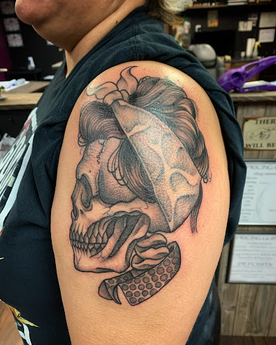 Work by Raven Mocker Tattoo