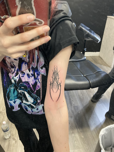 Work by Nickel & Brass Tattoo Collective