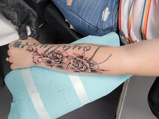 Work by Tattoo Factory of Largo