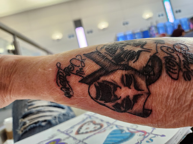 Work by Brown Ink Crew Tattoo Shop