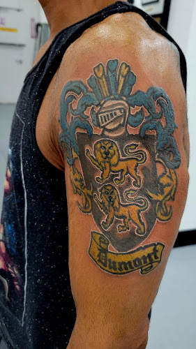 Work by Pogi Tattoo Shop