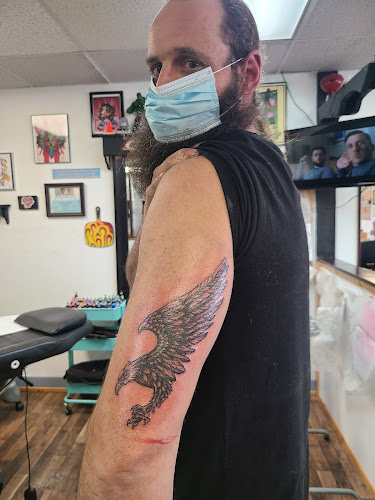 Work by Lawrence Tattoo Company
