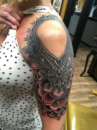Work by Bleeding Heart Tattoo