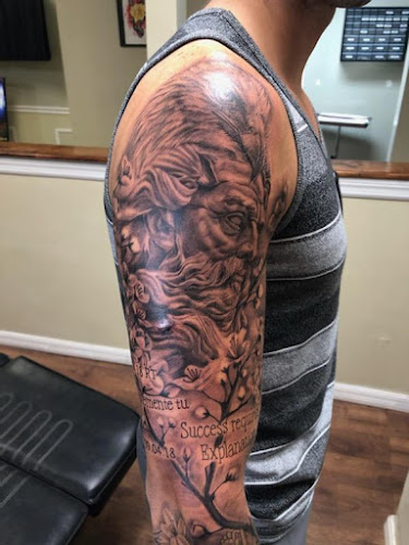 Work by Mpire Tattoo & Ink Company