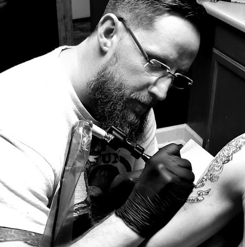 Work by Poisoned Pen Tattoo Co.