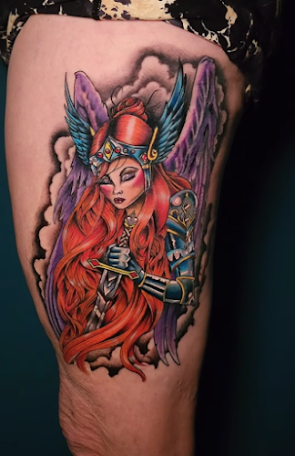 Work by Plumed Serpent Tattoo