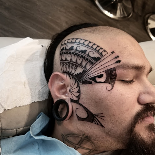 Work by Sacred Art Tattoo