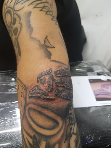 Work by Stigma Tattoo and Piercings Inc.