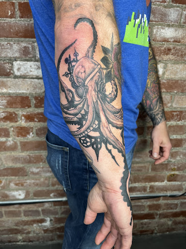 Work by Abandon Customs Tattoo Studio
