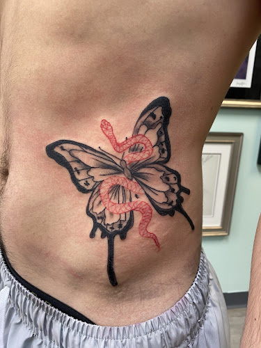 Work by Old Cat Tattoo & Piercing