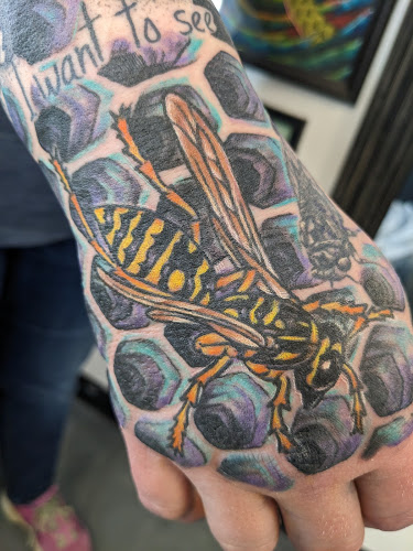 Work by Hand And Eye Tattoo