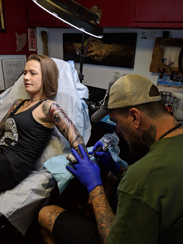 Work by Against the Grain Tattoos