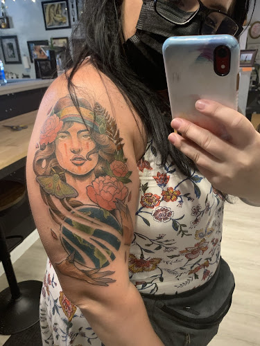 Work by Sacred Feather Tattoo
