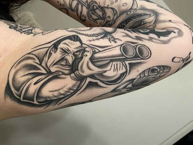 Work by 6 Feet Deep Tattoo and Piercings