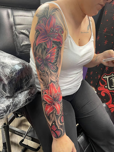 Work by Screaming Aces Tattoo shop