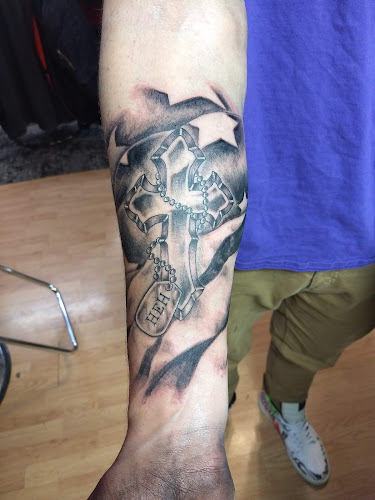 Work by Phat Joe's Drop of Ink Tattoos and Piercing