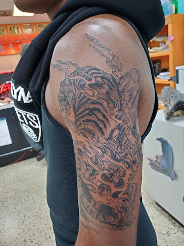 Work by Mid City Voodoux Tattoos