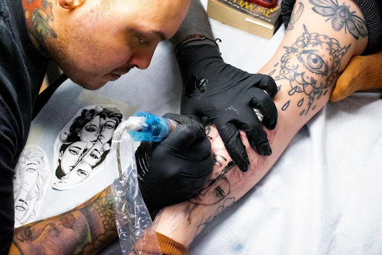 Work by Sacred Tattoo