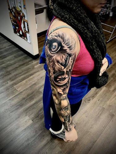 Work by Black Rose & Dagger Tattoo