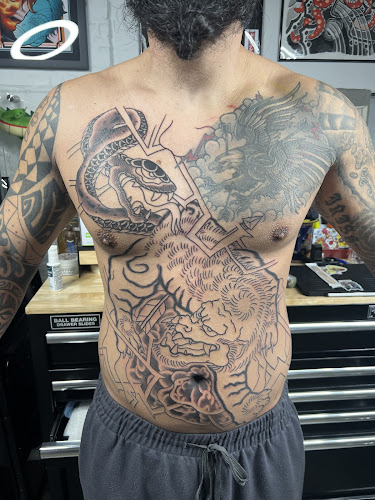 Work by Slow Ride Tattoo & Gallery