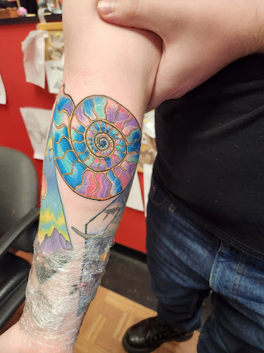 Work by Temperance Tattoo and Body Piercing