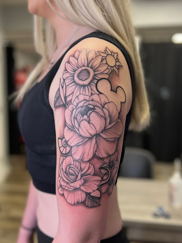 Work by Gilded Lotus Tattoo and Piercing