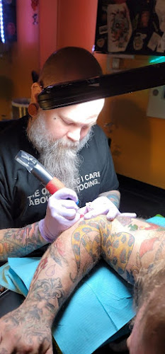 Work by Golden Horseshoe Tattoo Shop