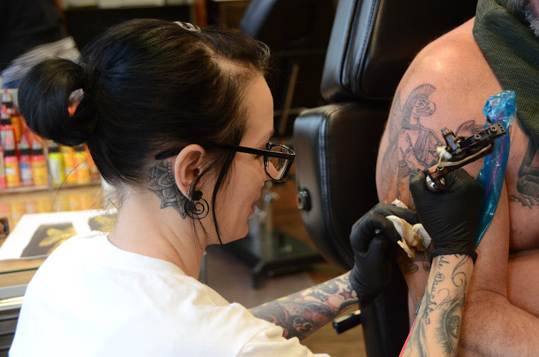 Work by Oshkosh Tattoo & Good Girl