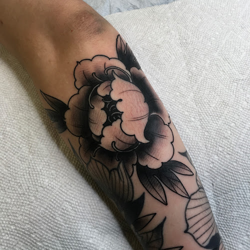Work by Pops' Tattoo Parlor