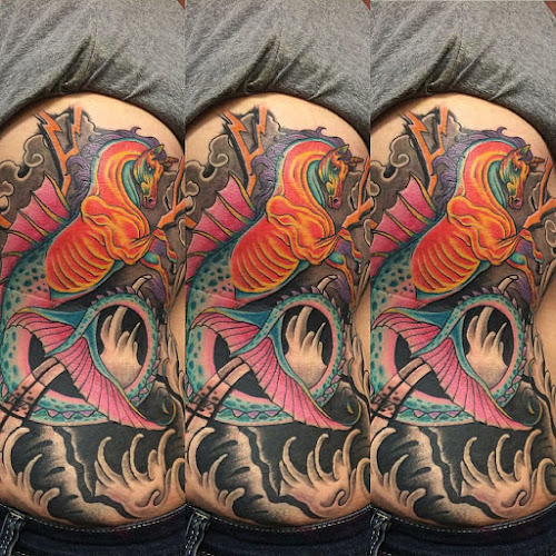 Work by Sacred Mountain Tattoo