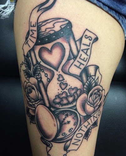 Work by Godspeed Tattoo and Body Piercing