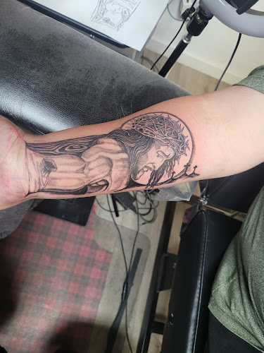 Work by Reed Between The Lines Tattoo Studio, LLC.