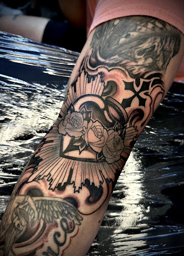 Work by Cholo Supreme Tattoos