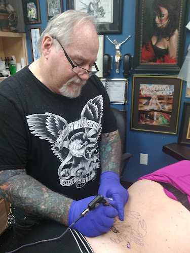 Work by Warlock's Tattoo and Eight Moons Piercing