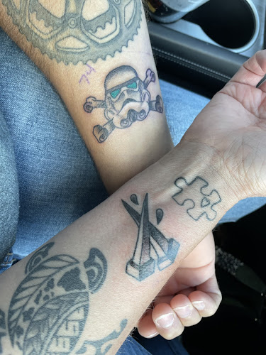 Work by Oak & Iron Tattoo and Piercing