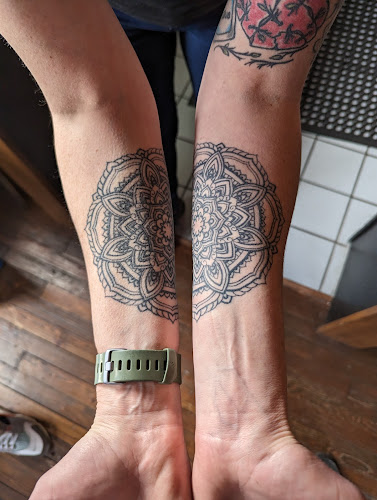 Work by Axe of Kindness Tattoo