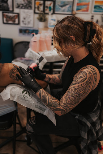 Work by Mesmer Tattoo, LLC.