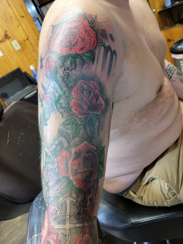 Work by Scotty Rock's Ink Slingers Tattoo Studio
