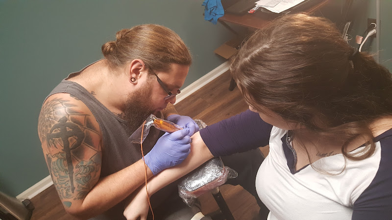 Work by New Creation Tattoo and Piercing