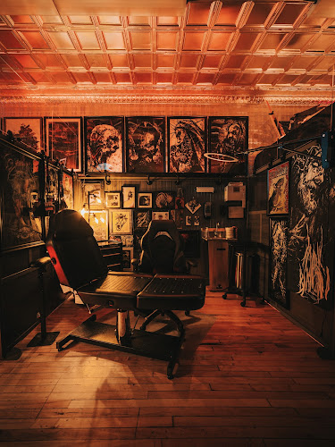 Work by Tomb Gallery & Tattoo