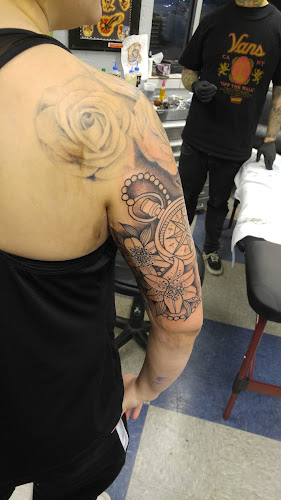 Work by Yellow Rose Tattoo