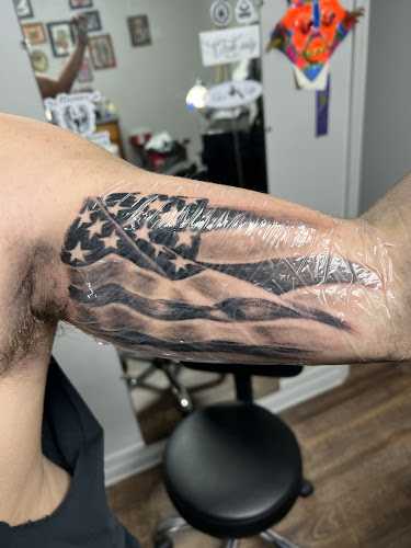 Work by Sacred Art Tattoos