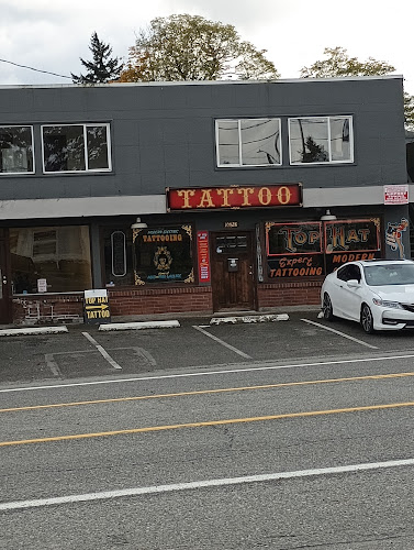 Work by Top hat Tattoo and Top Hat Barber Shop