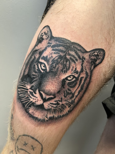 Work by Top Shelf Tattoo Collective