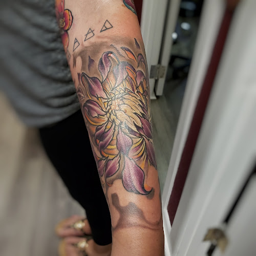 Work by Over Omega Tattooing