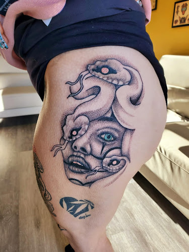 Work by Golden Cobra Tattoo Studio