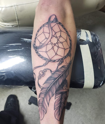 Work by Outlaw Tattoos and Piercings