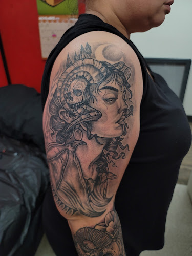 Work by Strange Days Tattoo